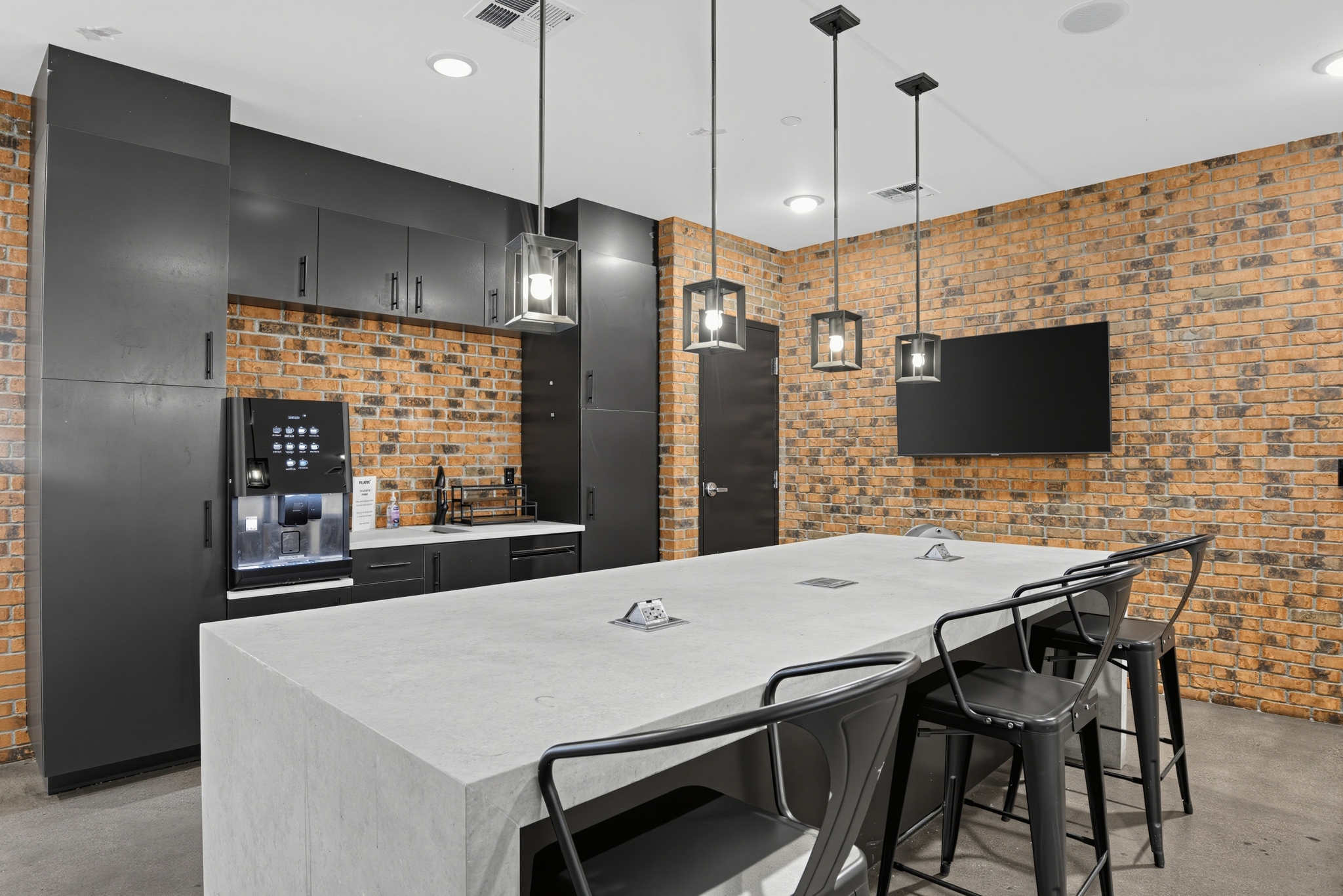 Entertainment Kitchen with Coffee Bar and Charging Stations at Flare Student Apartments in Tempe, AZ