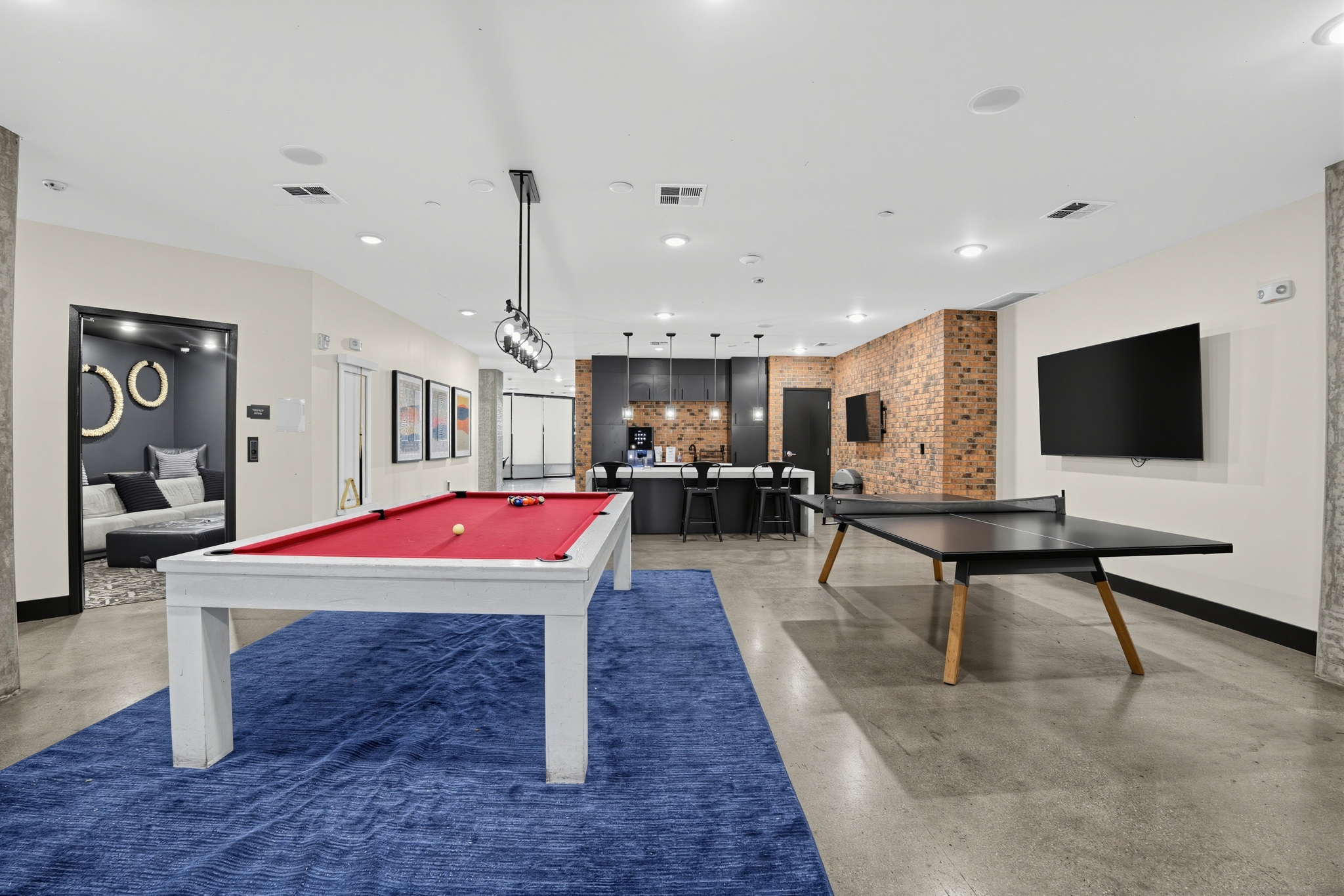 Club Room with Billiards, Ping Pong, and Entertainment Kitchen at Flare Student Apartments in Tempe, AZ