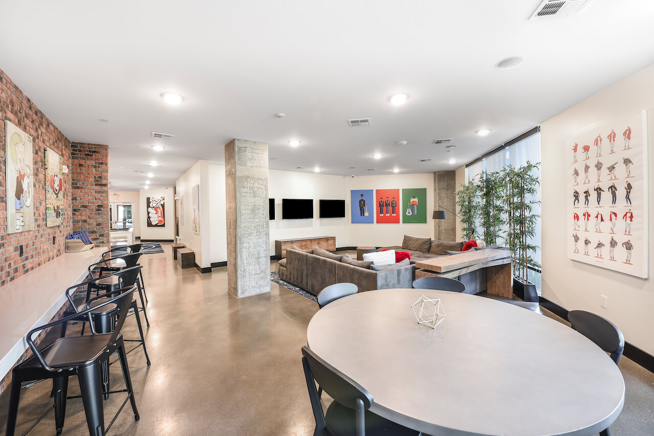 Interior lounge with seating artwork and a dining table