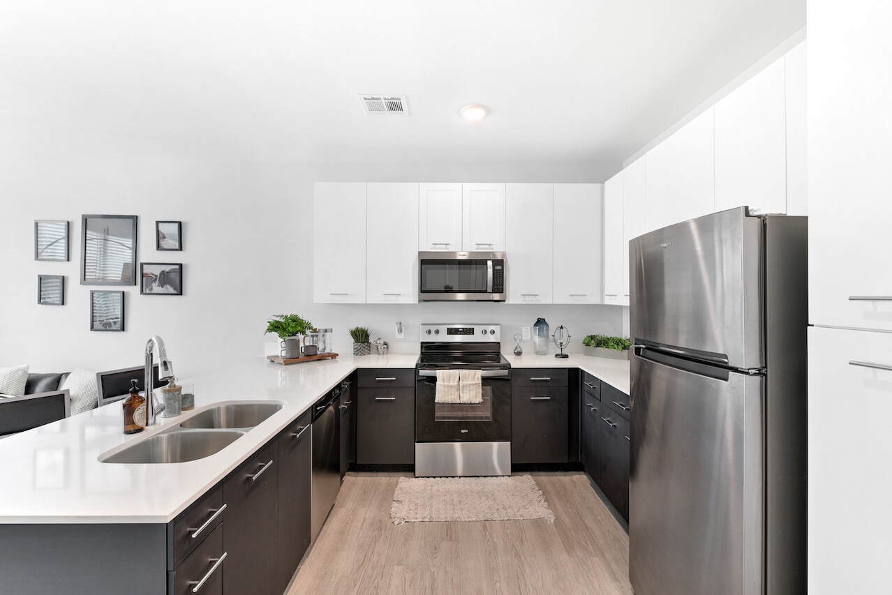 Modern kitchen with stainless steel appliances and white cabinetry