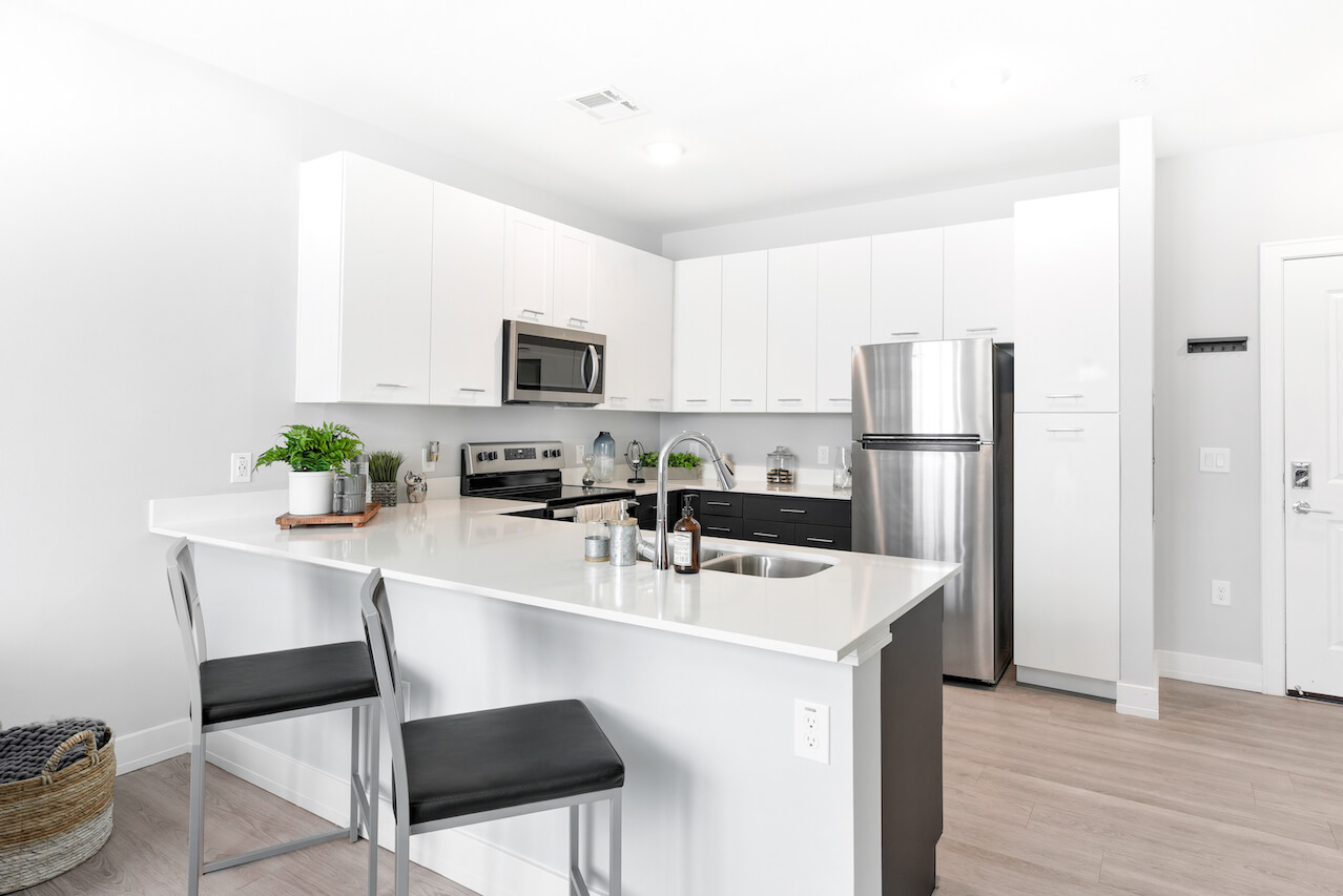 Modern kitchen with stainless steel appliances and white cabinets