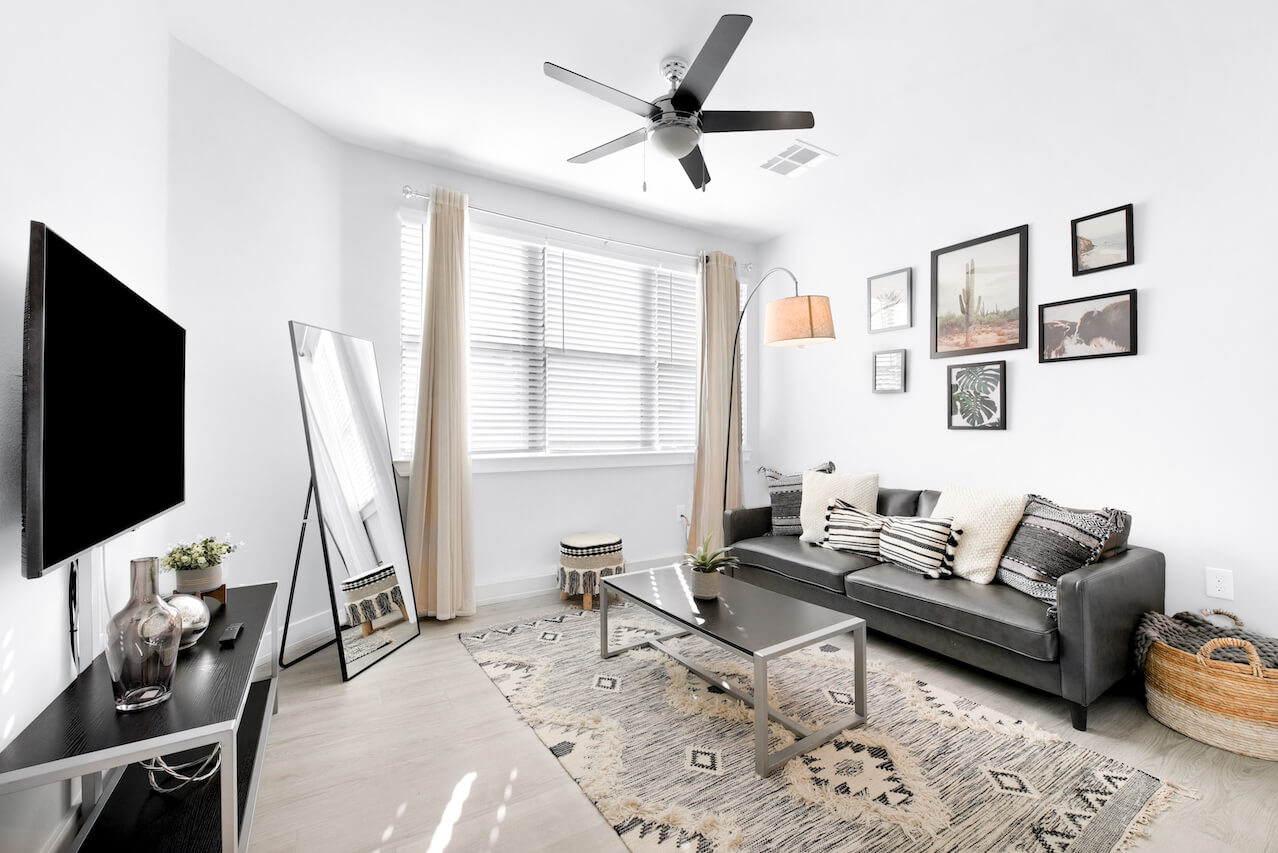 Modern living room with a sofa mirror and decorative elements