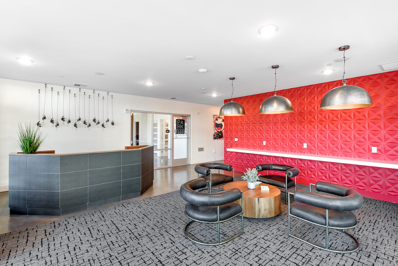Modern lobby with a reception desk and stylish seating