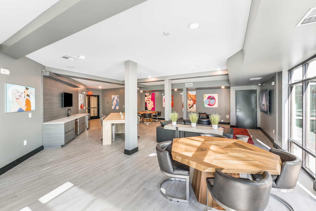 Modern lounge area with art tables and seating