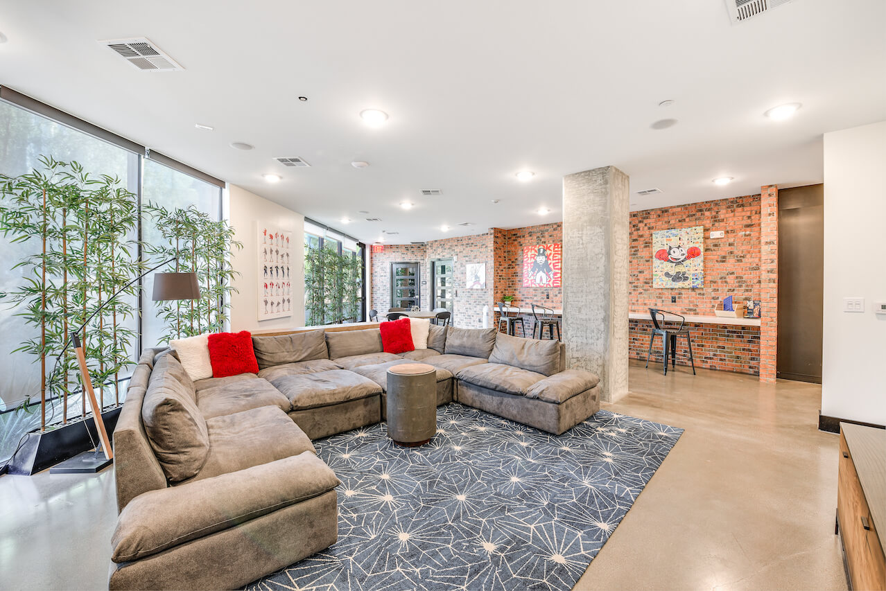 Modern lounge with a large sectional sofa and artwork