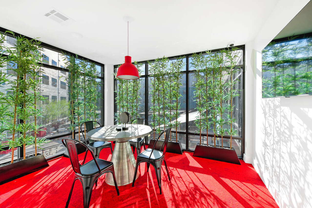 Modern study room with red carpet and bamboo decor