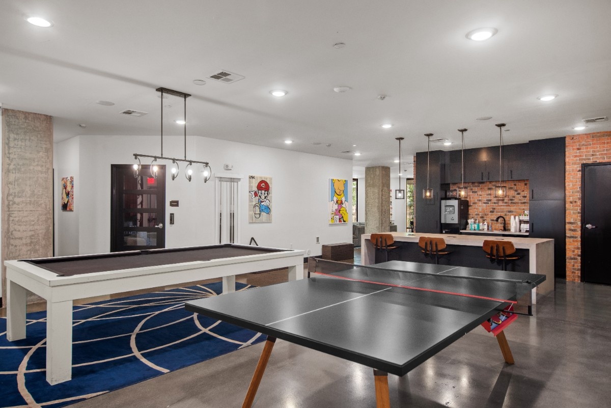 Recreational room with a ping pong table and kitchenette