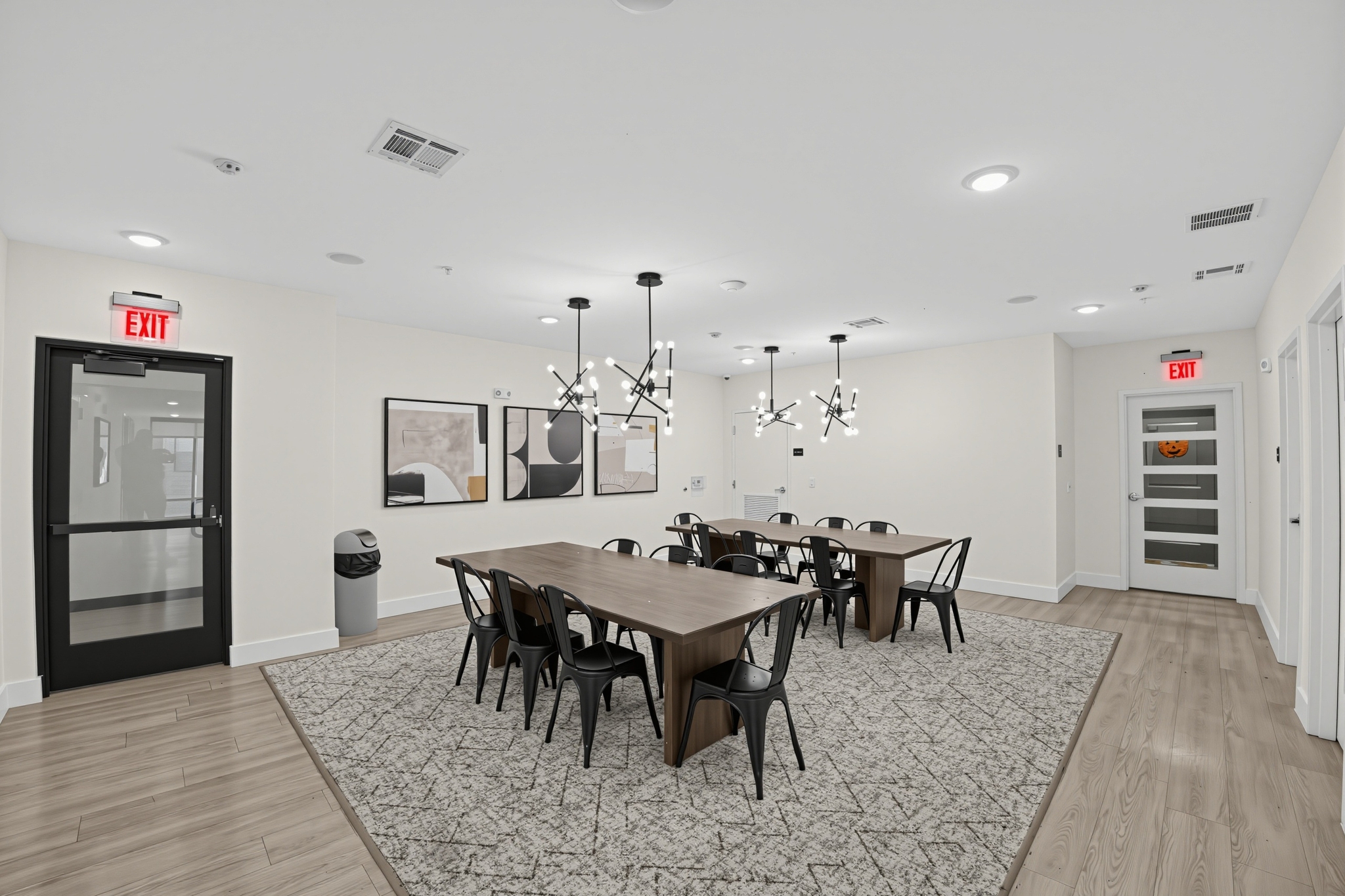 group study area wooden tables geometric rug