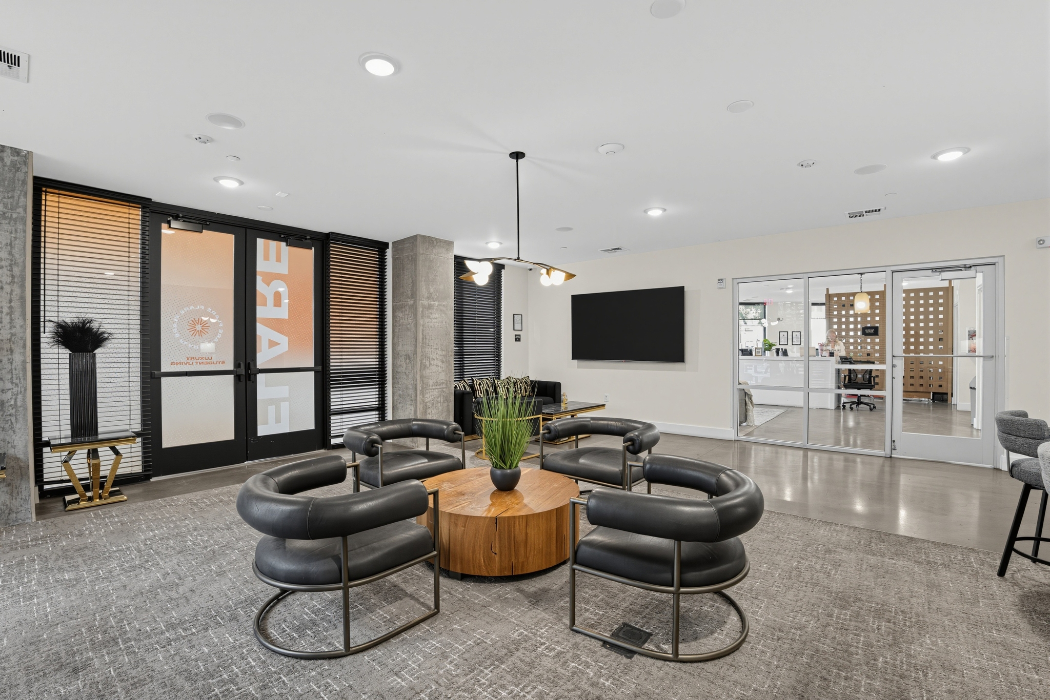 resident seating area leather armchairs wood table